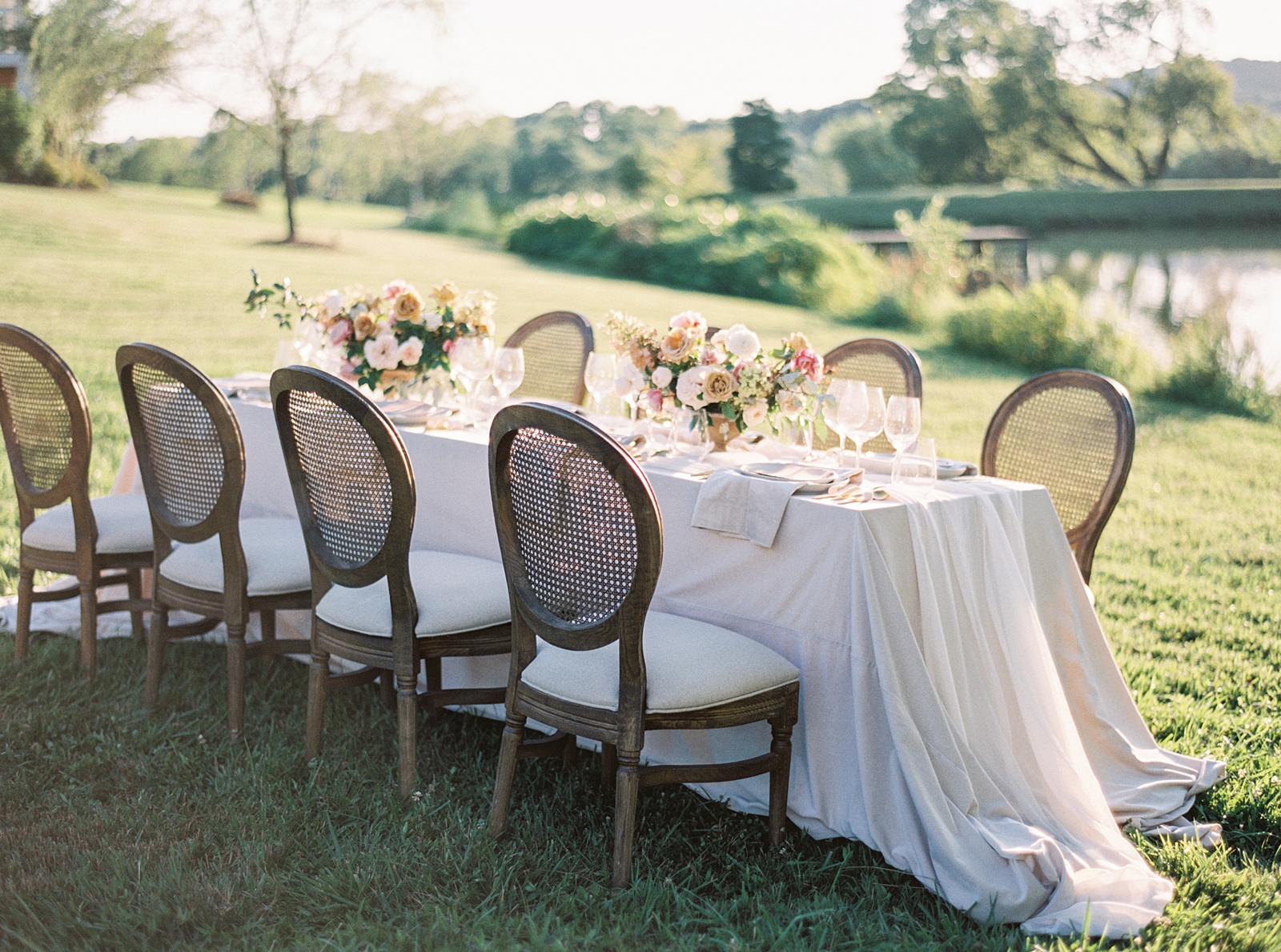 Beautiful colorful wedding tablescape with flowers and gold flatware at Mint Springs Farm