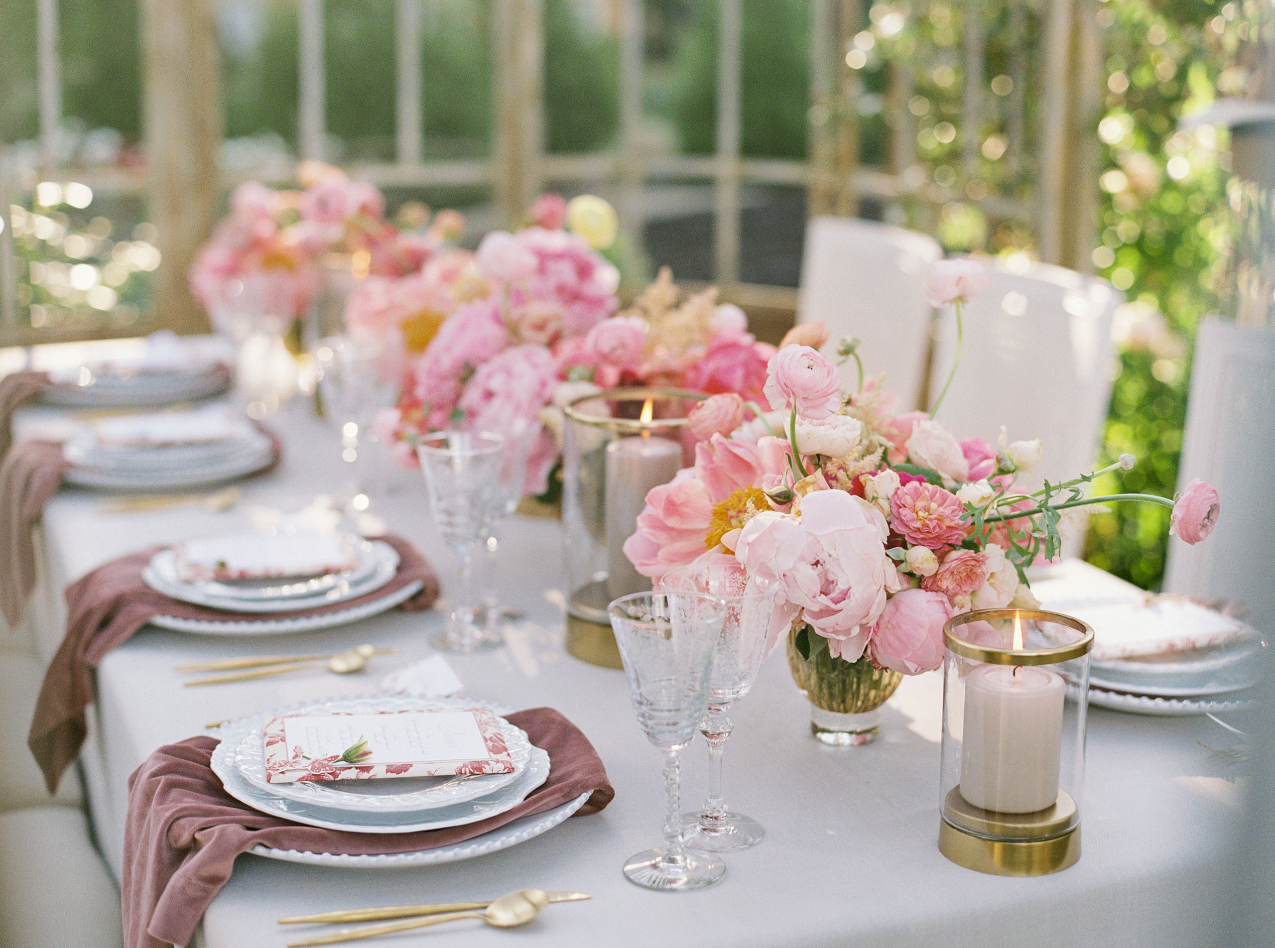 Beautiful outdoor tablescape for wedding with pink garden roses. Photographed on film by Chicago based destination wedding photographer Sarah Sunstrom Photography.